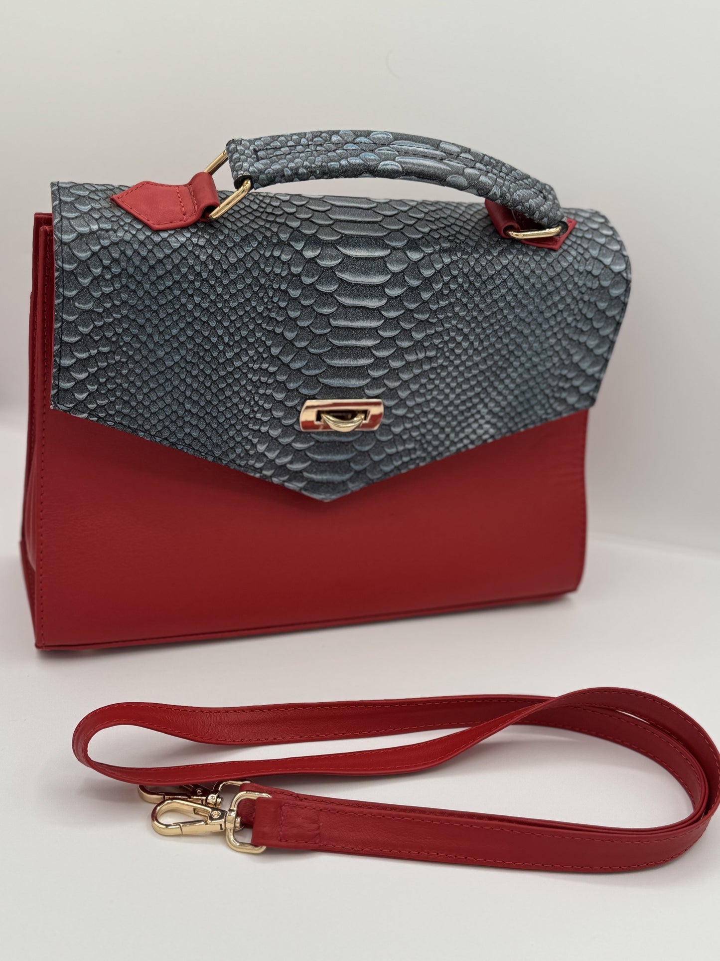 RED LEATHER HANDBAG W/PYTHON-EMBOSSED FLAP.